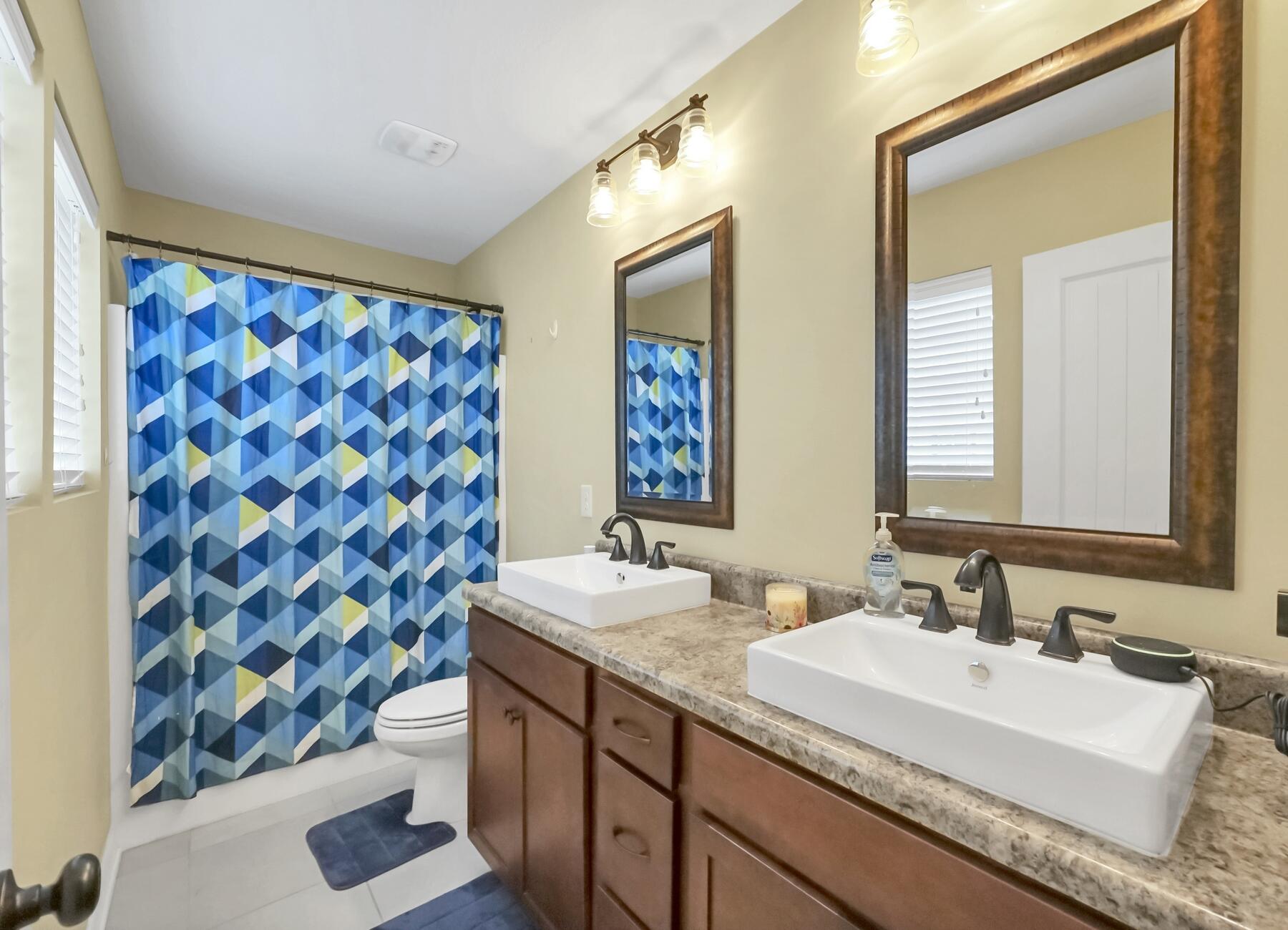 220 Wainwright Drive Crestview, FL 32539 - Photo 37 of 56 a bathroom with a granite countertop sink and a mirror