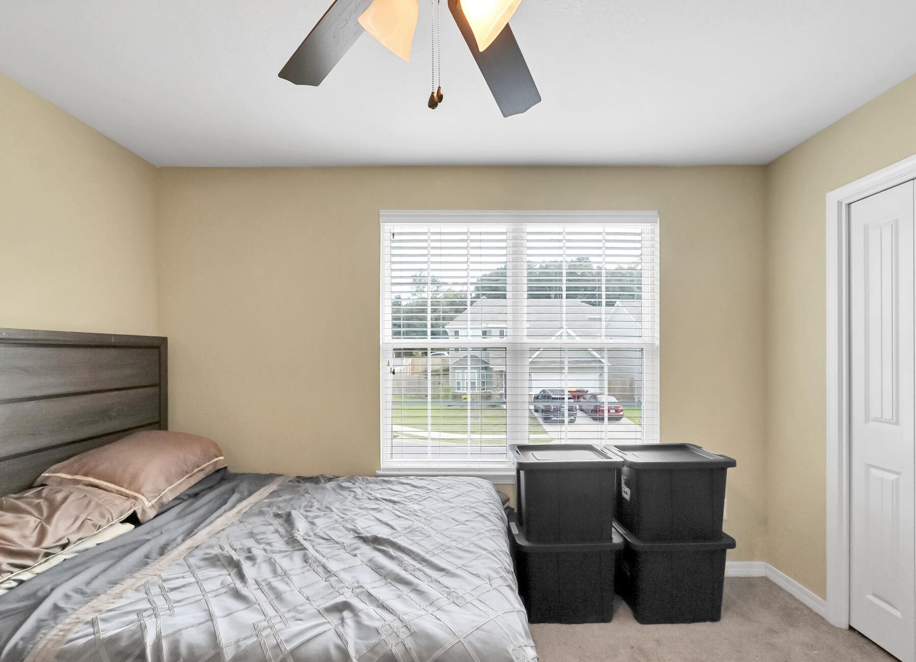 220 Wainwright Drive Crestview, FL 32539 - Photo 41 of 56 a bedroom with a bed and a large window