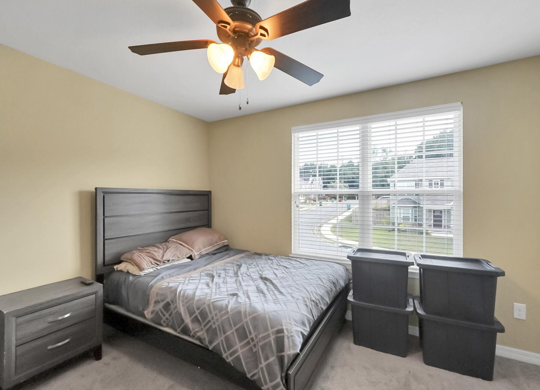 220 Wainwright Drive Crestview, FL 32539 - Photo 42 of 56 a bedroom with a bed and a large window