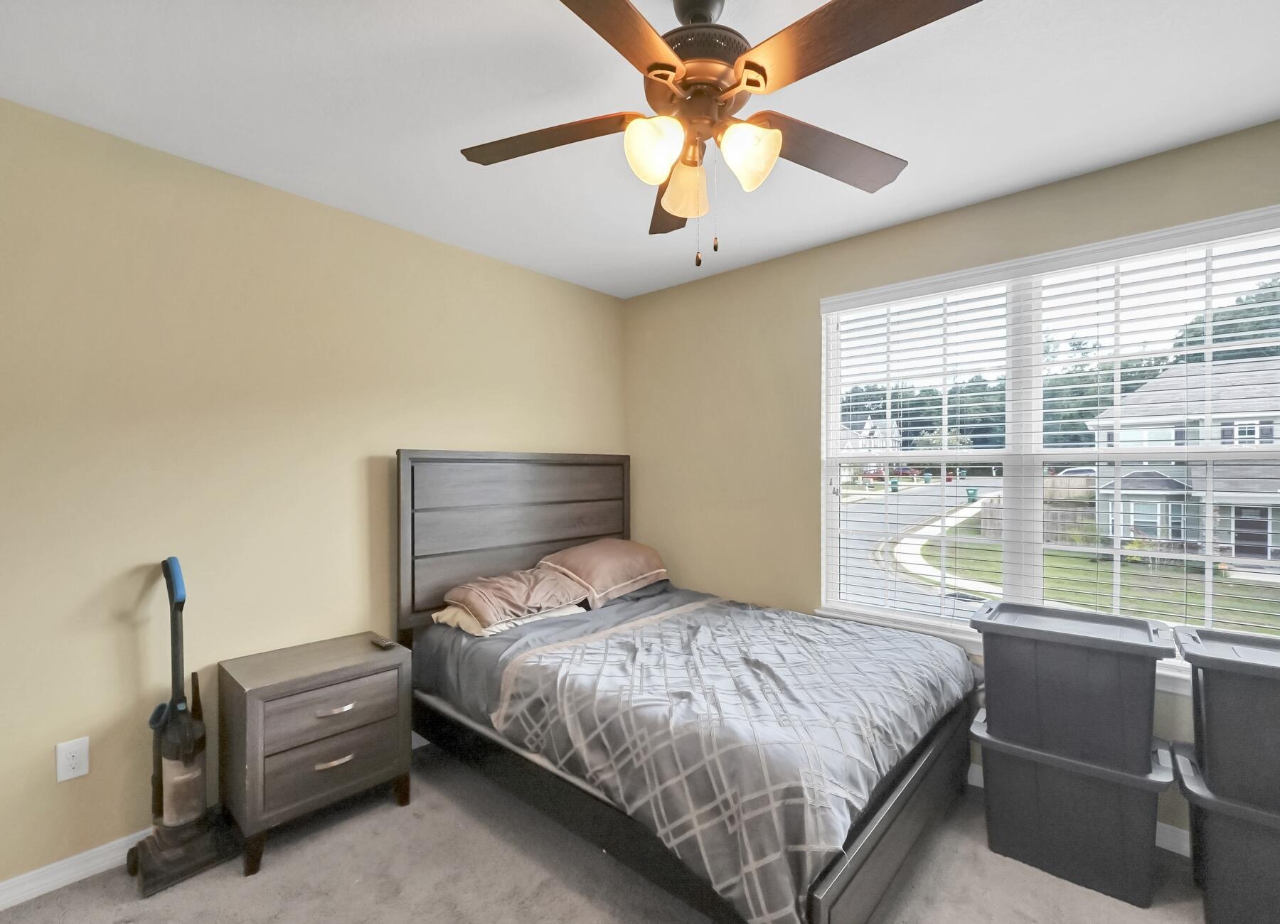 220 Wainwright Drive Crestview, FL 32539 - Photo 43 of 56 a bedroom with a bed and a large window