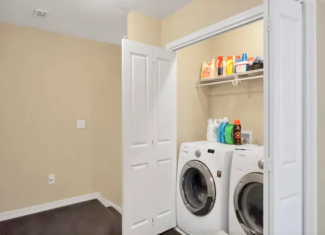 a bathroom with a sink and mirror with bathtub