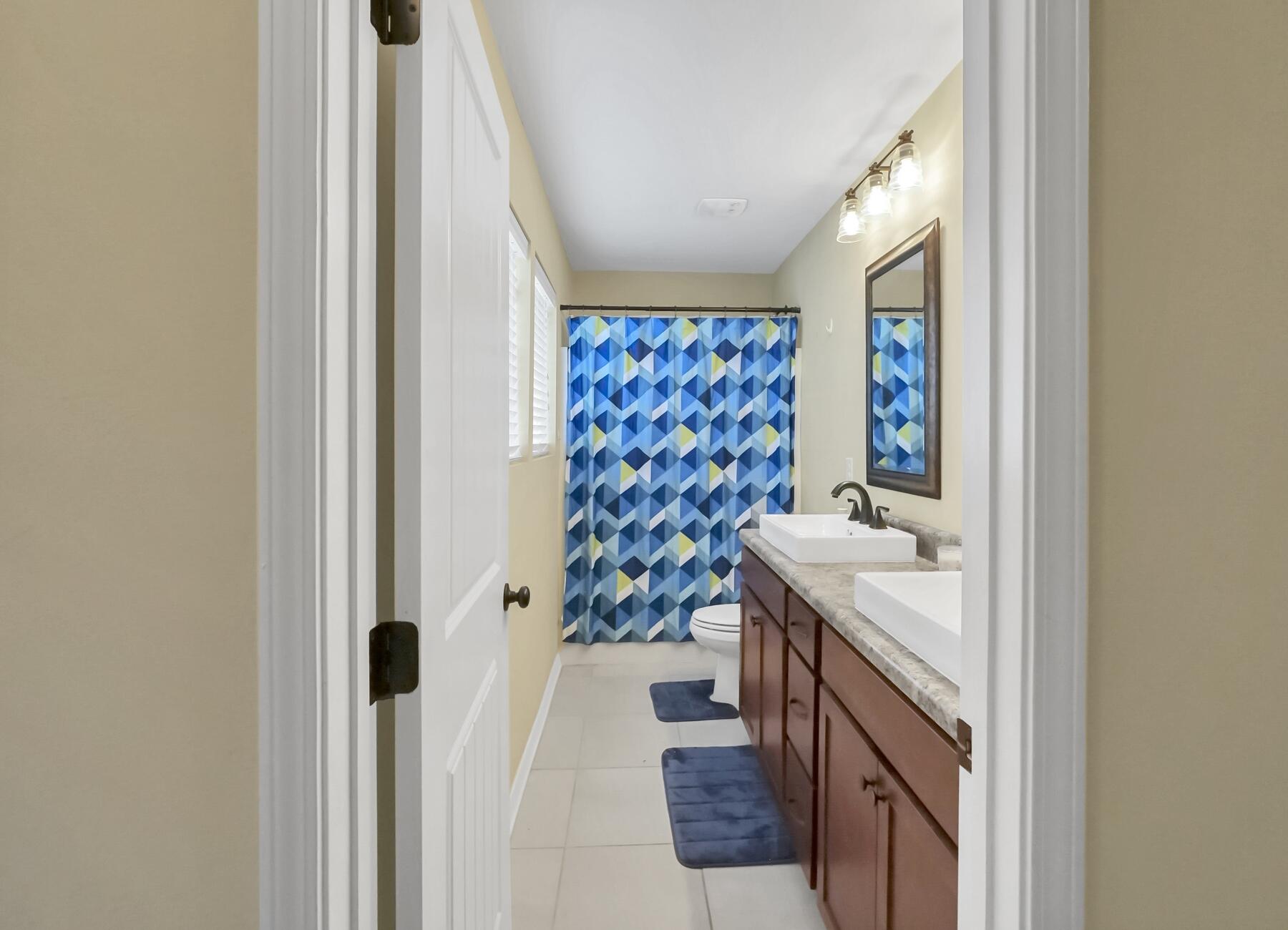 220 Wainwright Drive Crestview, FL 32539 - Photo 47 of 56 a bathroom with a sink and mirror with bathtub
