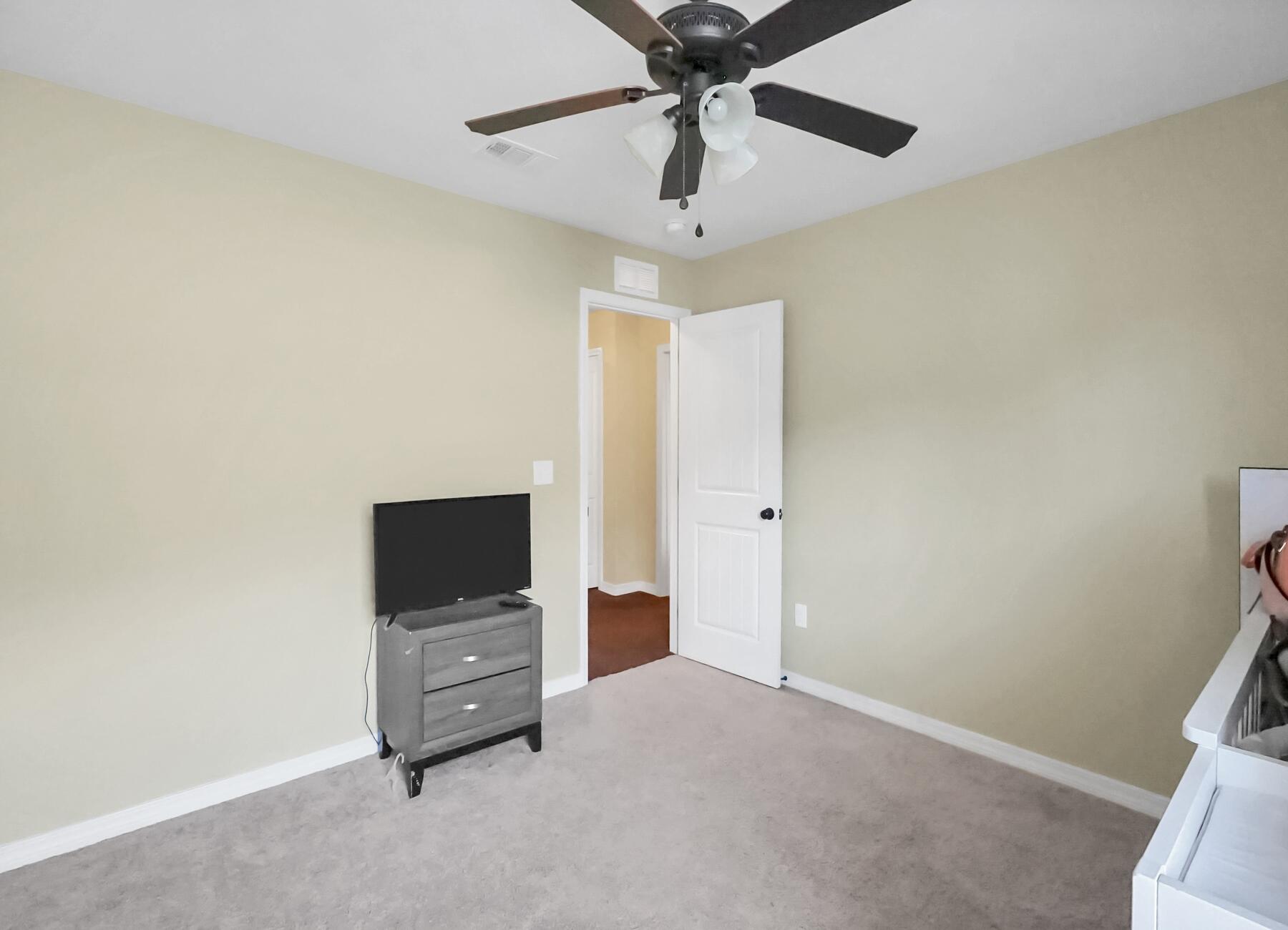 220 Wainwright Drive Crestview, FL 32539 - Photo 48 of 56 an empty room with a flat screen tv