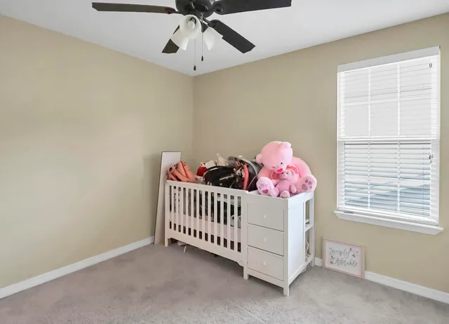a view of a backyard with a wooden fence