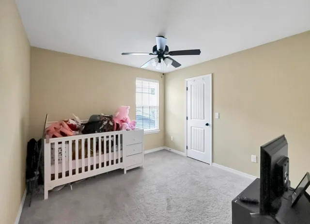 a view of a backyard with a garden and entertaining space