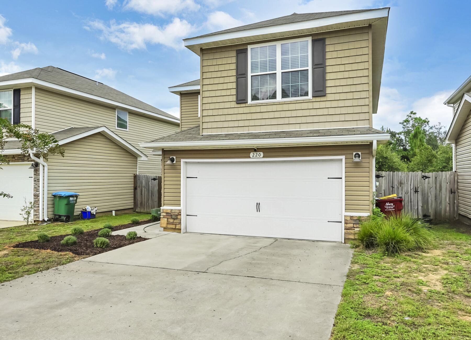 220 Wainwright Drive Crestview, FL 32539 - Photo 5 of 56 a view of a house with backyard and garden