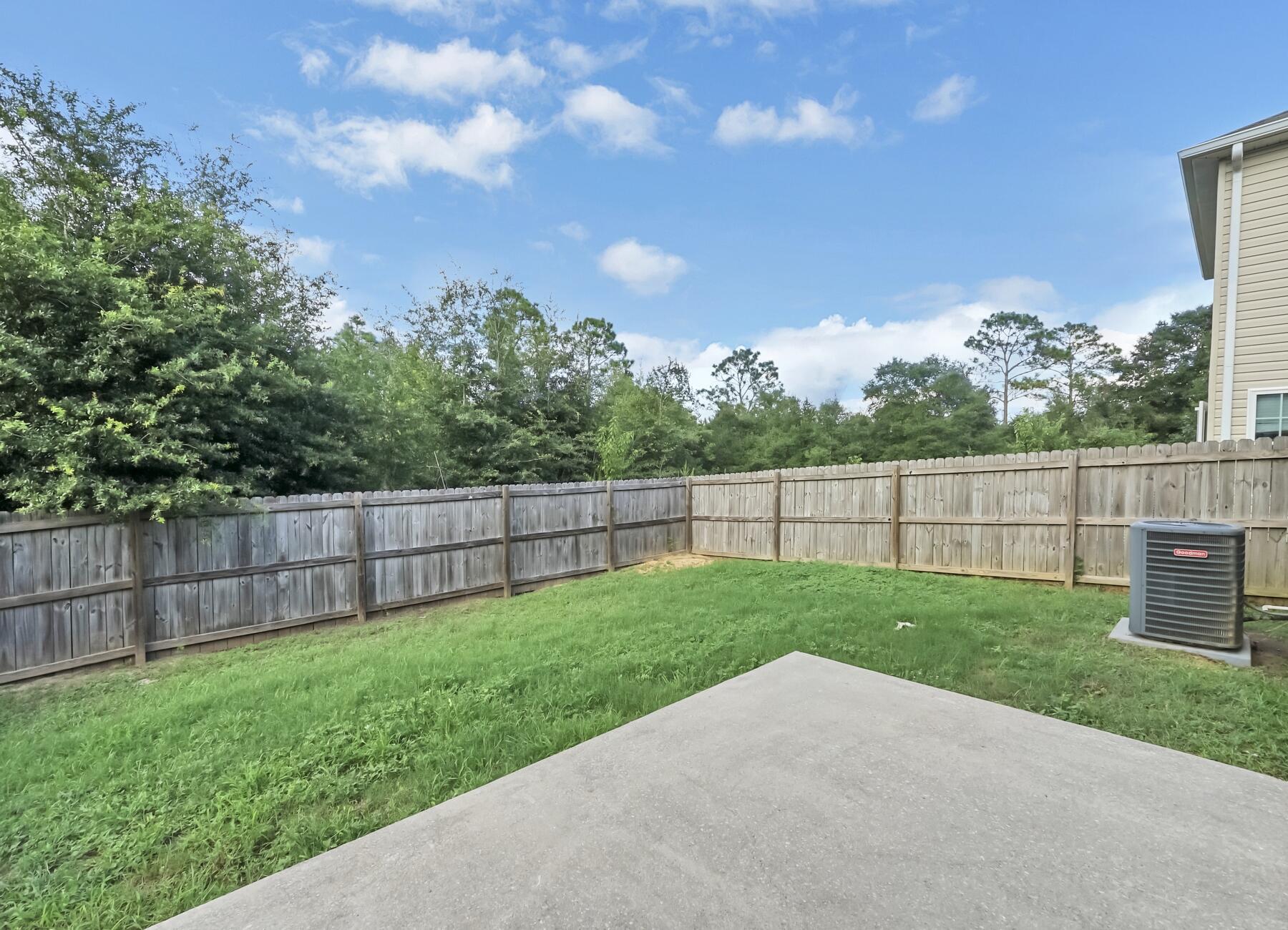 220 Wainwright Drive Crestview, FL 32539 - Photo 54 of 56 a view of a backyard with a garden