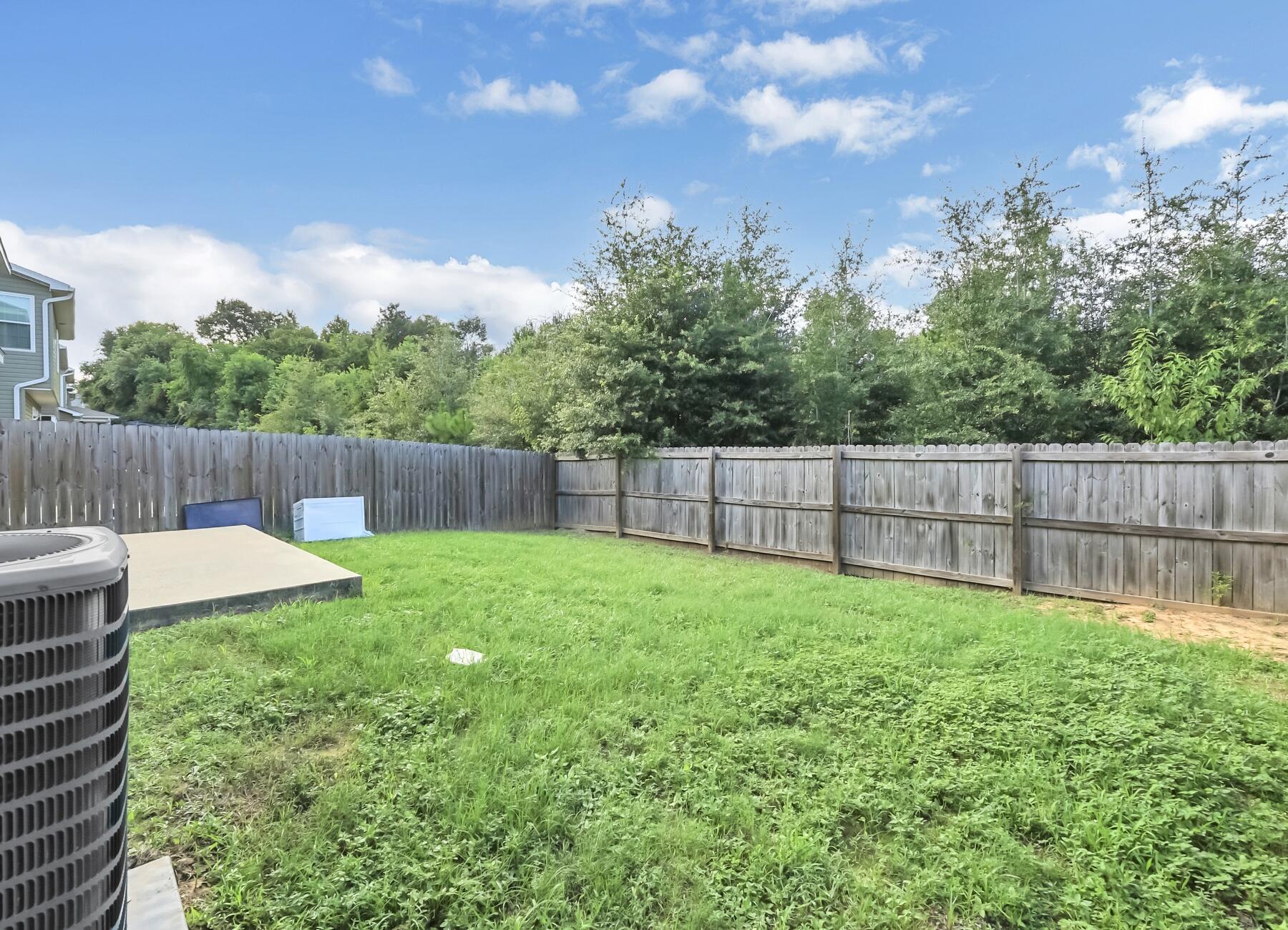 220 Wainwright Drive Crestview, FL 32539 - Photo 56 of 56 a view of a backyard with a garden and entertaining space