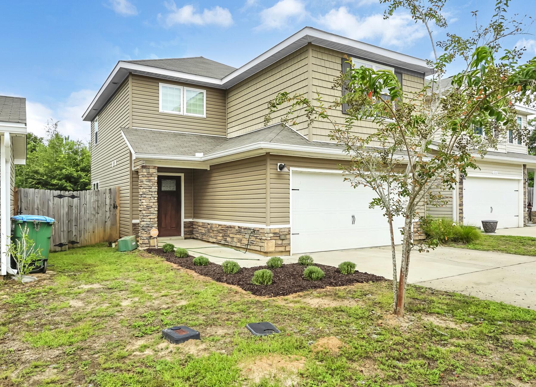 220 Wainwright Drive Crestview, FL 32539 - Photo 8 of 56 a house that has a tree in front of the house