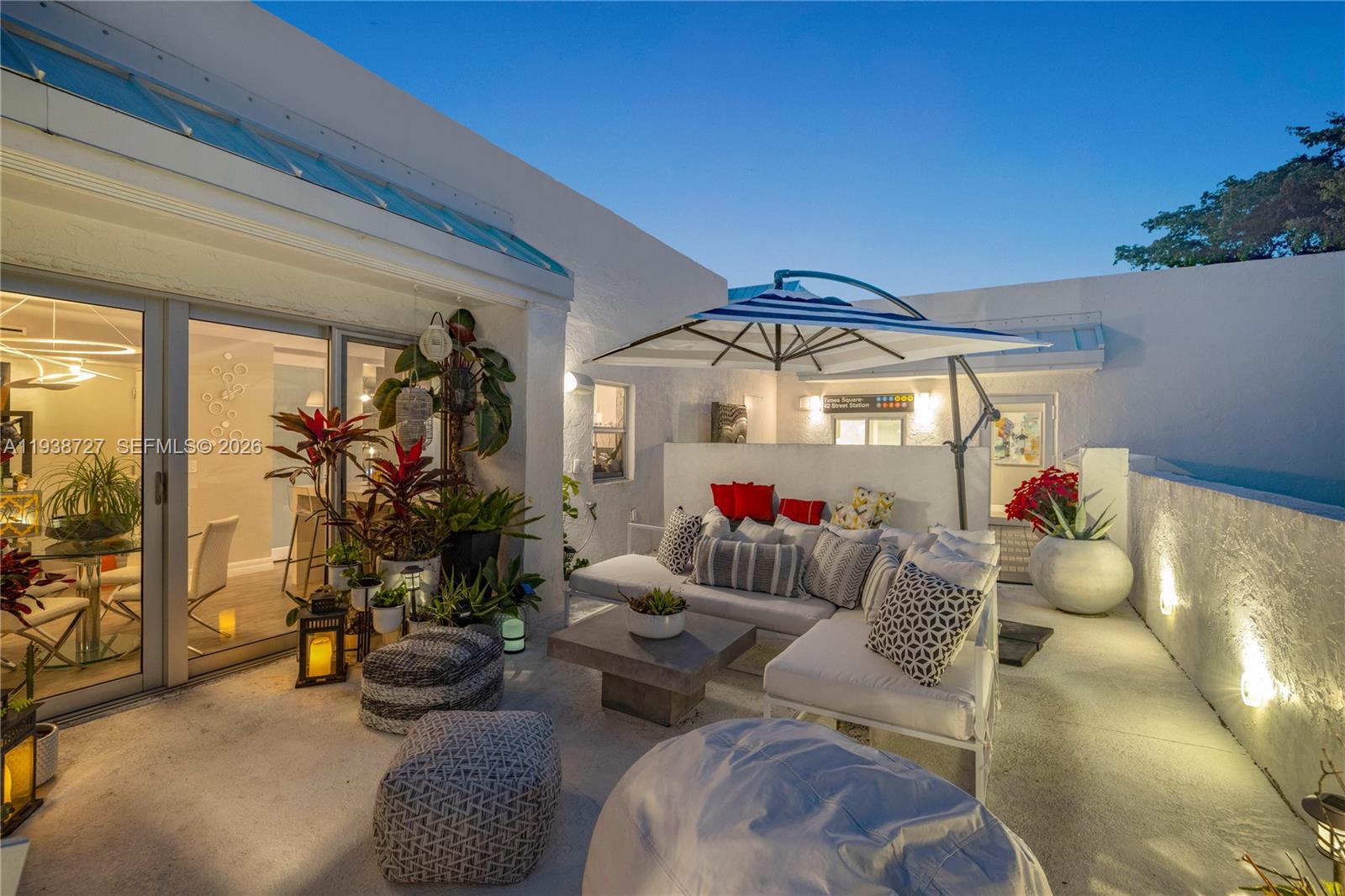 680 Northeast 64th Street, Unit APH3 Miami, FL 33138 - Photo 20 of 38 a living room with furniture and a potted plant