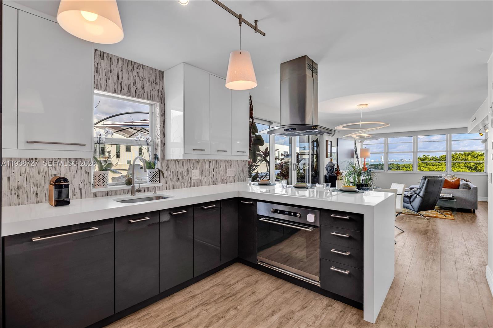 680 Northeast 64th Street, Unit APH3 Miami, FL 33138 - Photo 2 of 38 a kitchen with lots of counter space and a sink