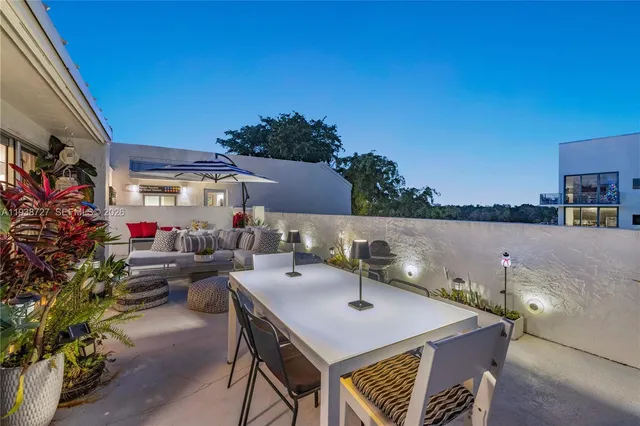 a terrace of a house with outdoor seating