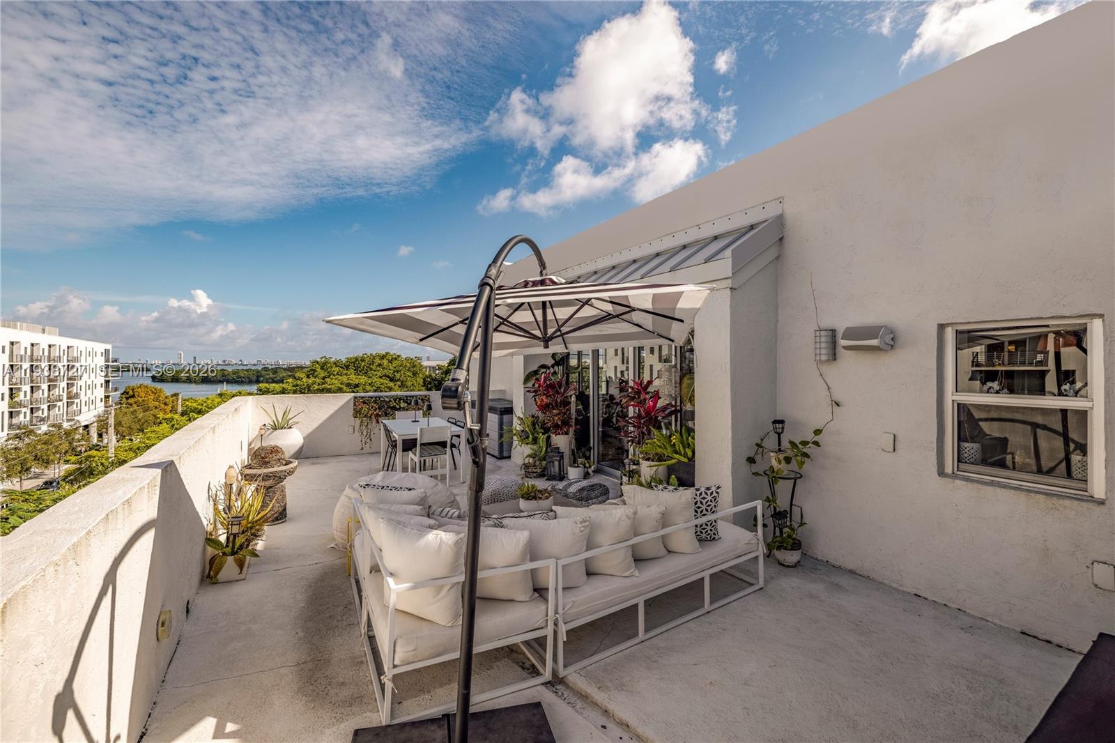 680 Northeast 64th Street, Unit APH3 Miami, FL 33138 - Photo 24 of 38 a view of a livingroom with furniture