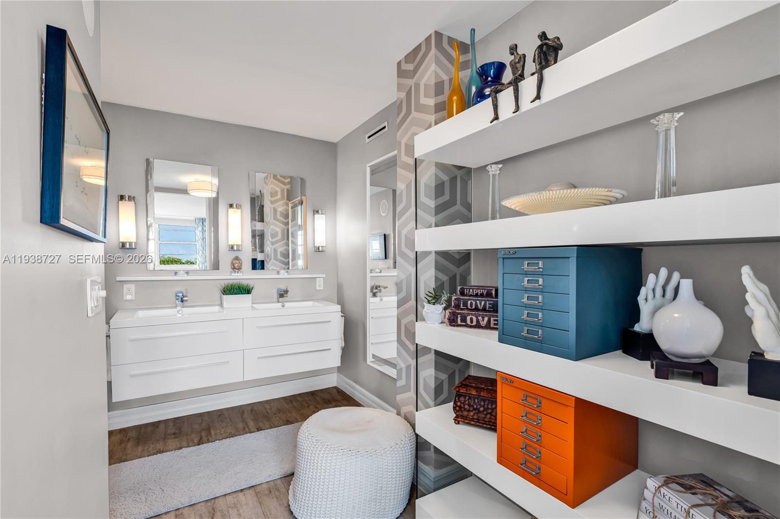 680 Northeast 64th Street, Unit APH3 Miami, FL 33138 - Photo 6 of 38 a room with stainless steel appliances kitchen island a table and chairs in it