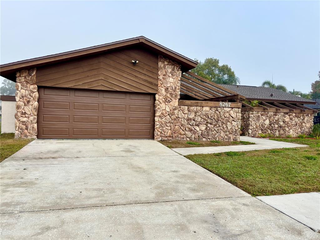 8267 Norwood Road Seminole, FL 33777 - Photo 1 of 1 a front view of a house with a yard