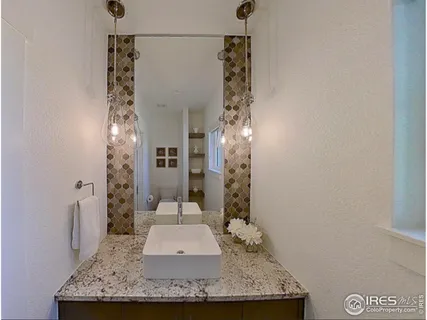 a work room with furniture and a large window