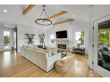 a living room with fireplace furniture and a flat screen tv