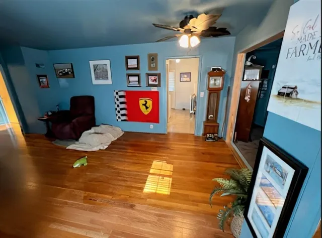 a view of a livingroom with furniture workspace and a window