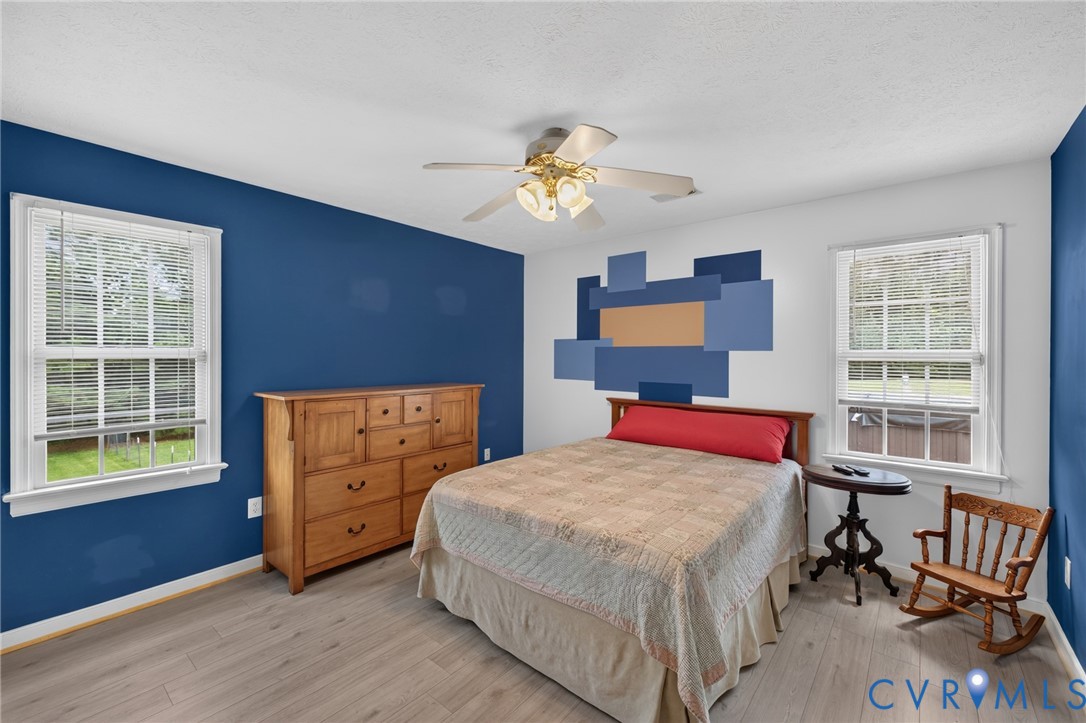 2335 Dorrell Road Aylett, VA 23009 - Photo 14 of 26 Bright room featuring two windows, wood-finish flo