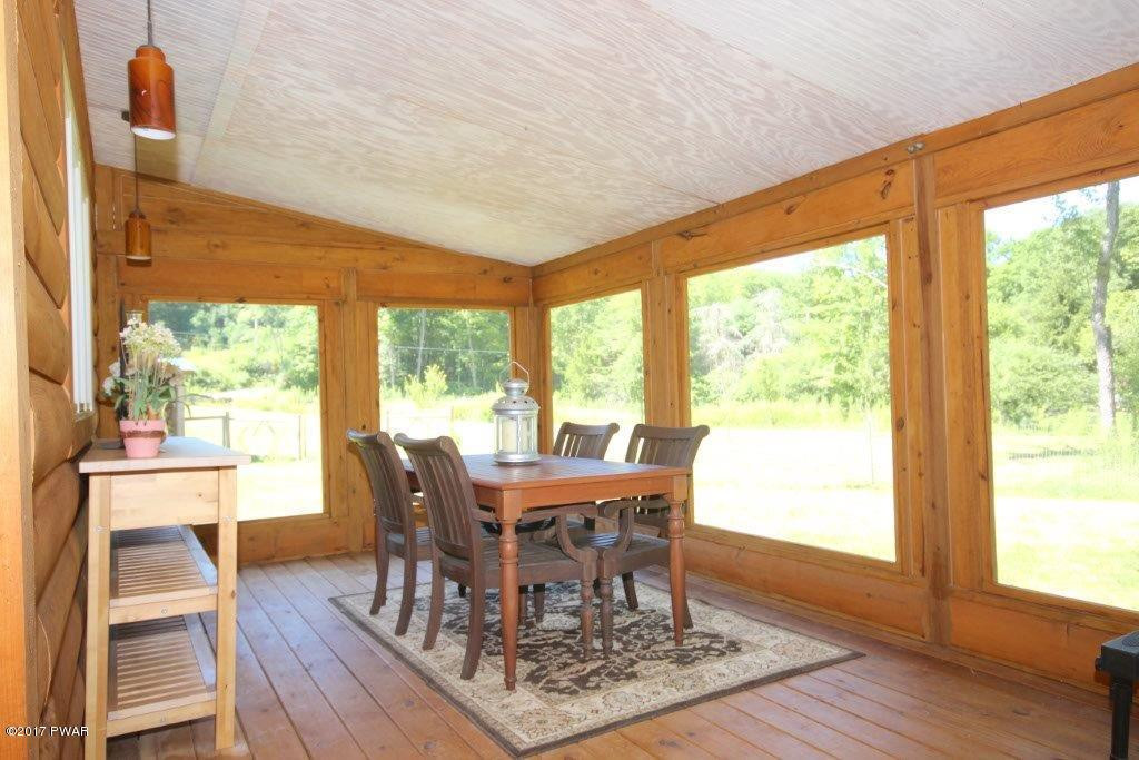 4 Swamp Road Pleasant Mount, PA 18453 - Photo 18 of 35 ENCLOSED PORCH DINING AREA