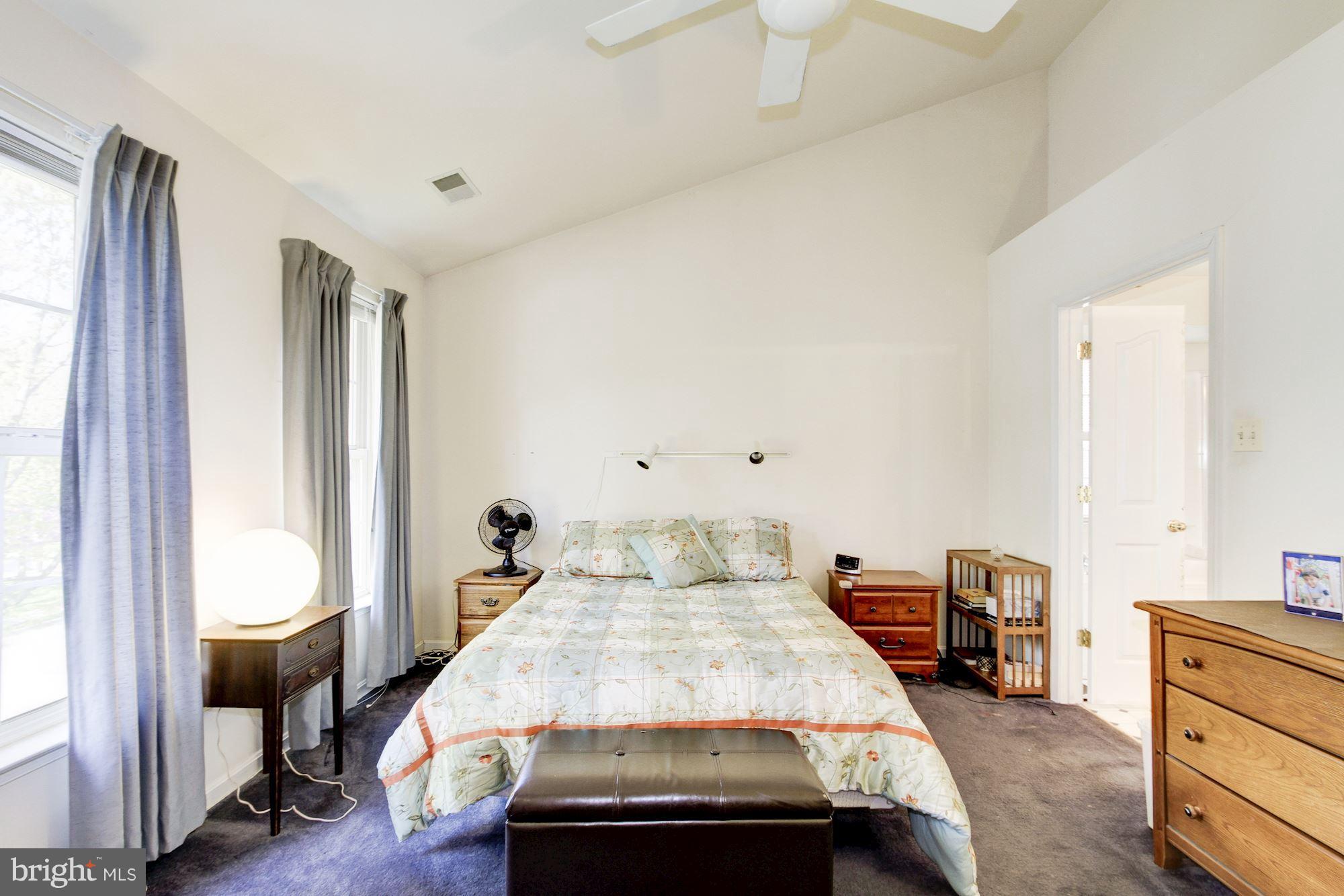 3043 Old Channel Road Laurel, MD 20724 - Photo 14 of 30 a bedroom with a bed and wooden floor