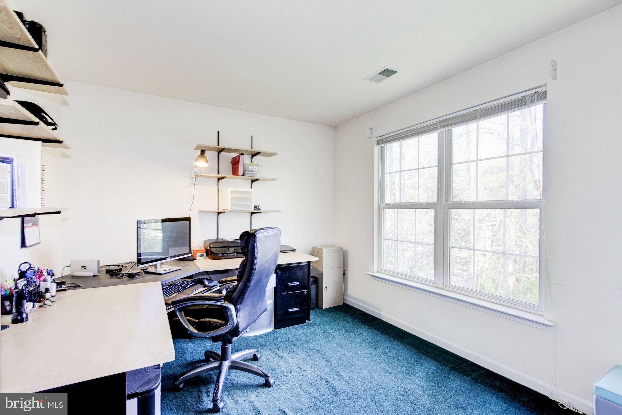 3043 Old Channel Road Laurel, MD 20724 - Photo 22 of 30 a view of a workspace with furniture and a window