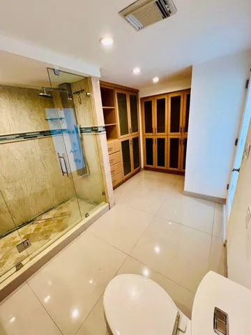 a view of bathroom with a sink and mirror