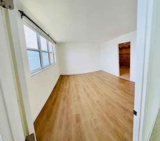 a view of empty room with windows