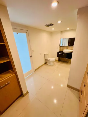 a view of a living room with furniture and a window