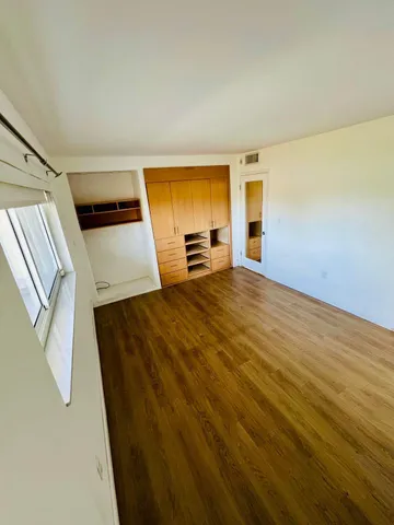 a view of an empty room with a fireplace