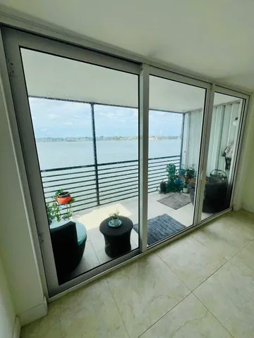 a view of a porch with a floor to ceiling window