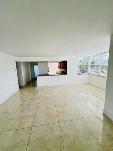 a view of an empty room with a fireplace