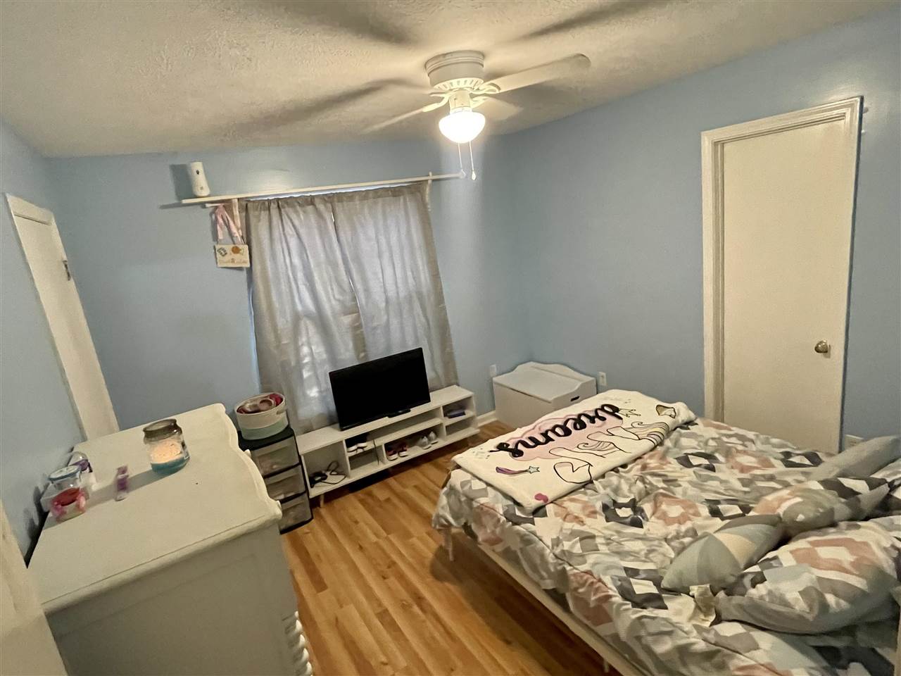 315 Rich Road Savannah, TN 38372 - Photo 11 of 20 a bedroom with a bed and a tv