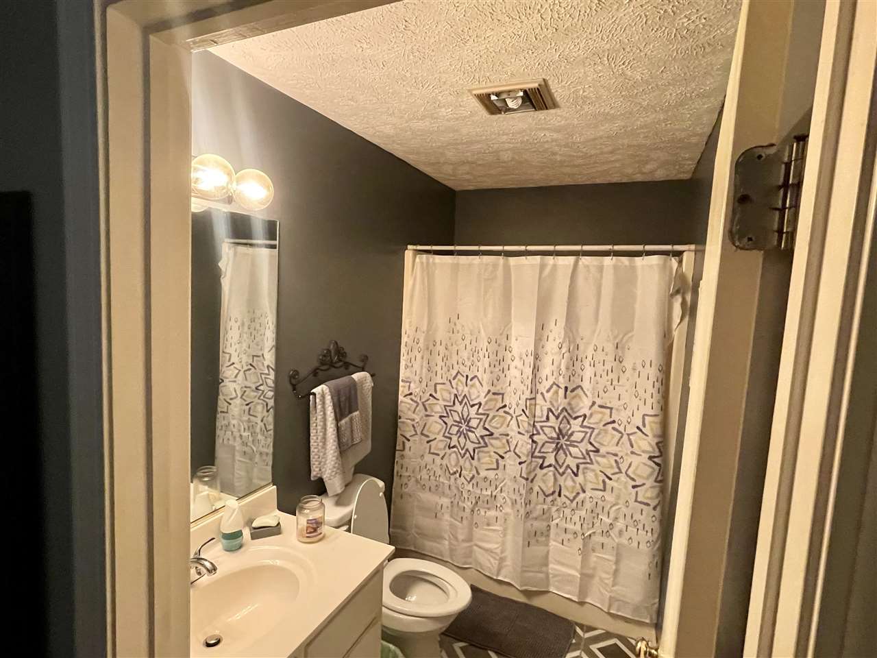 315 Rich Road Savannah, TN 38372 - Photo 12 of 20 a bathroom with a sink and a mirror