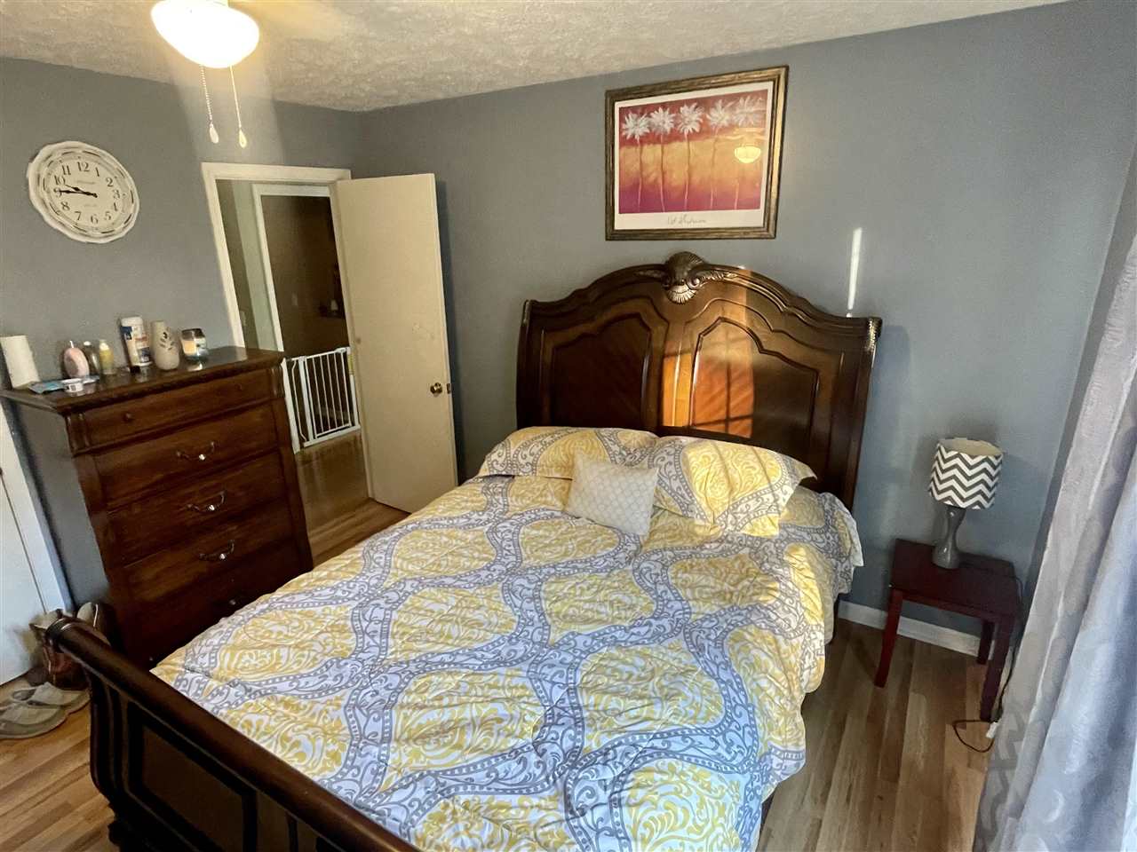 315 Rich Road Savannah, TN 38372 - Photo 13 of 20 a bed sitting in a bedroom next to a window