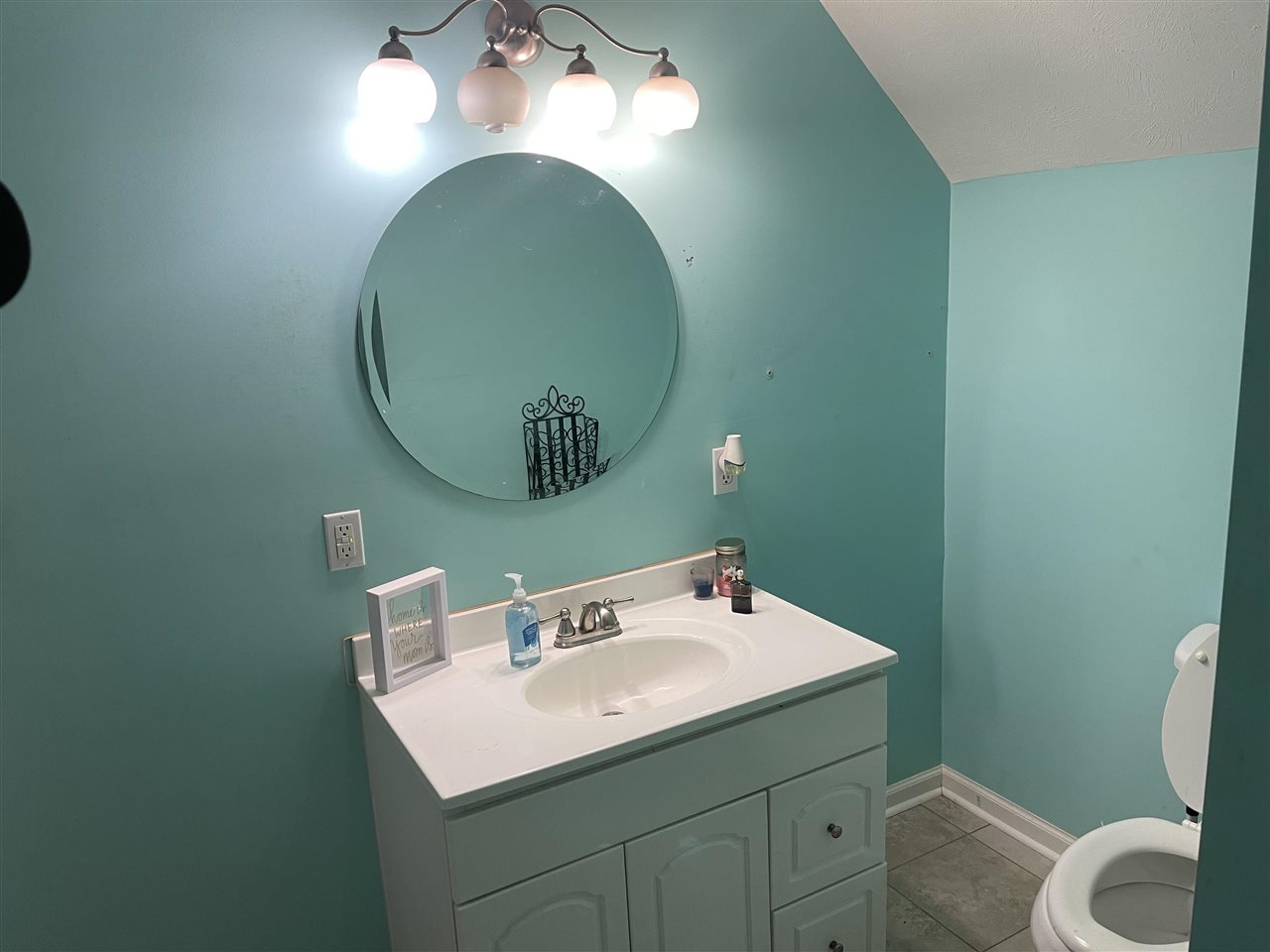 315 Rich Road Savannah, TN 38372 - Photo 14 of 20 a bathroom with a sink and mirror