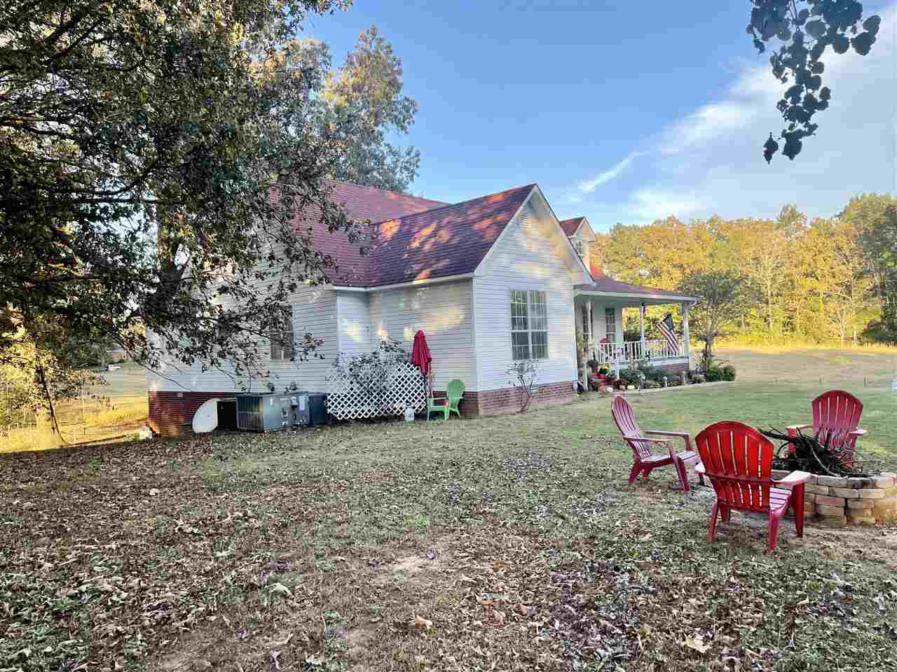 315 Rich Road Savannah, TN 38372 - Photo 17 of 20 a view of a house with backyard porch and sitting area