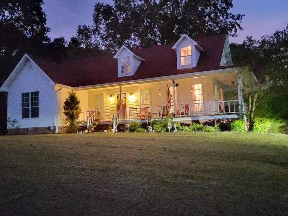 315 Rich Road Savannah, TN 38372 - Photo 20 of 20 a front view of a house with a yard and garage