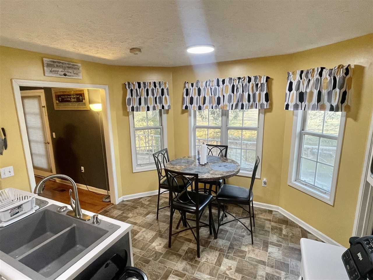 315 Rich Road Savannah, TN 38372 - Photo 3 of 20 a view of a dining room with furniture and window