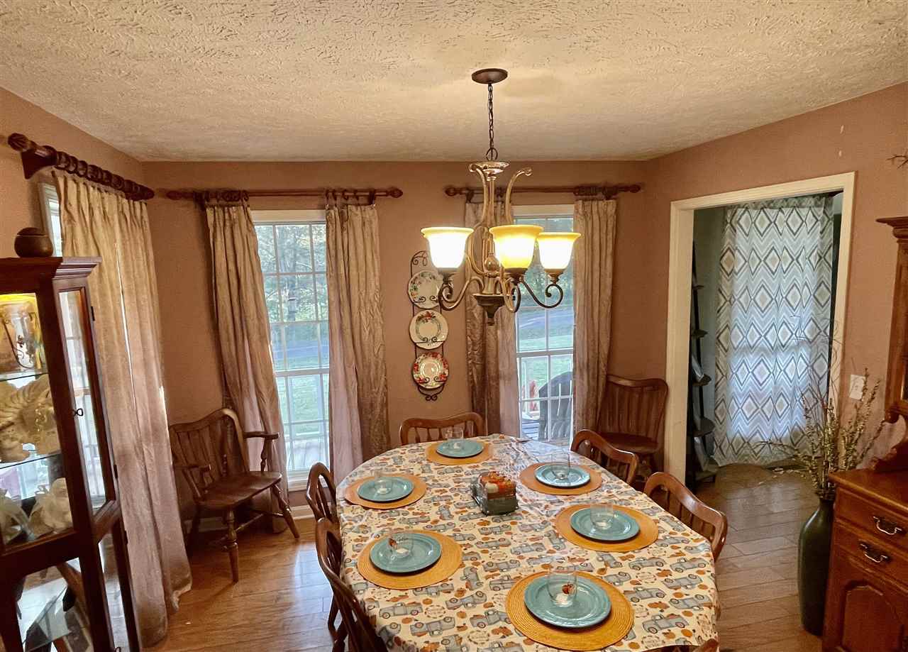 315 Rich Road Savannah, TN 38372 - Photo 4 of 20 a view of a dining room with furniture window and wooden floor