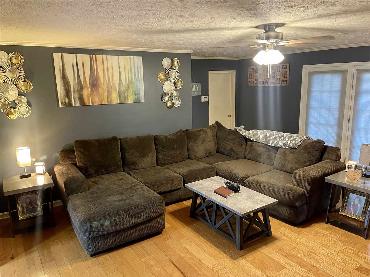 315 Rich Road Savannah, TN 38372 - Photo 7 of 20 a living room with furniture and a chandelier