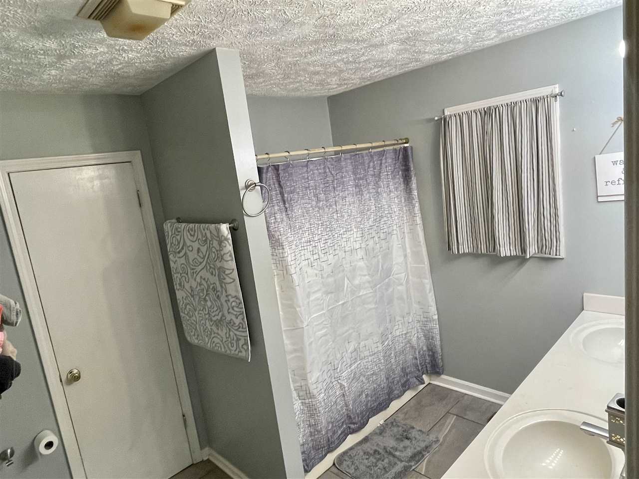 315 Rich Road Savannah, TN 38372 - Photo 10 of 20 a bathroom with a sink toilet and shower