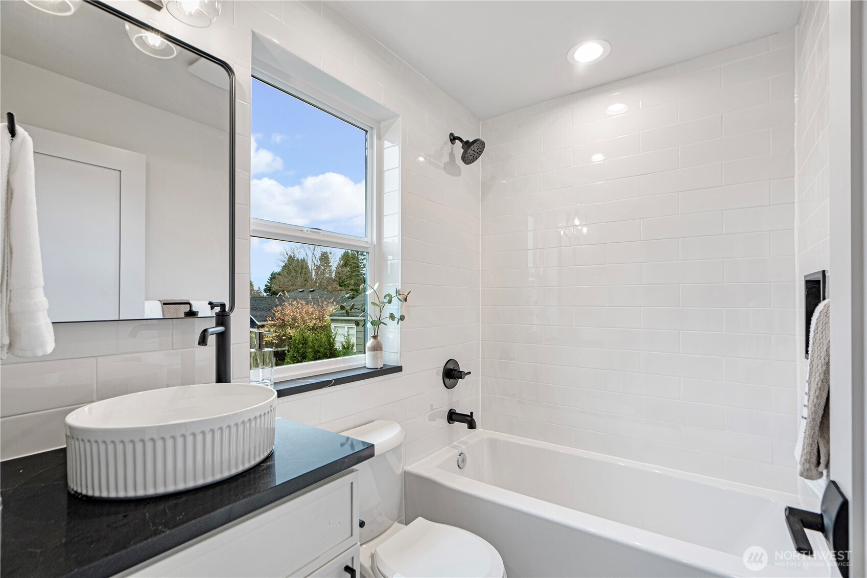 3054 Fairmount Avenue Southwest Seattle, WA 98116 - Photo 9 of 18 a bathroom with a tub toilet and sink