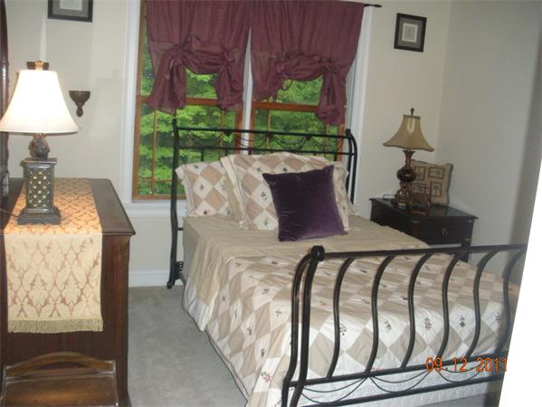 Lot 8 Florence Road Northampton, MA 01062 - Photo 30 of 30 a bed sitting in a bedroom next to a window