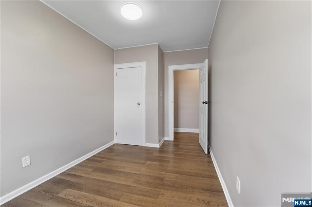 102 Exton Avenue North Arlington, NJ 07031 - Photo 13 of 18 a view of hallway with wooden floor