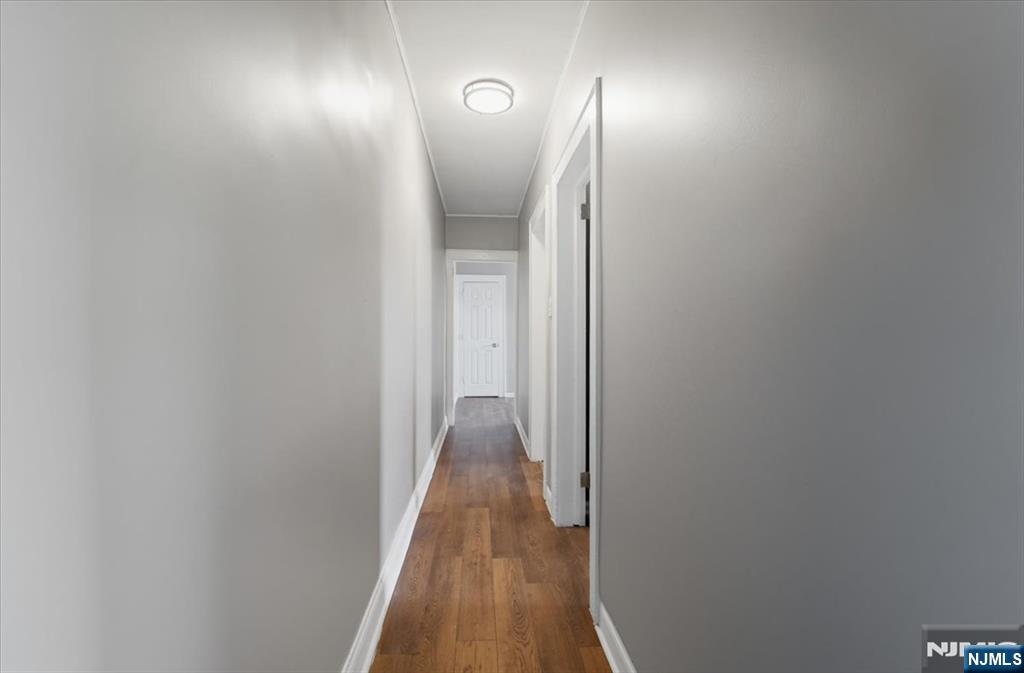 102 Exton Avenue North Arlington, NJ 07031 - Photo 8 of 18 a view of hallway with wooden floor