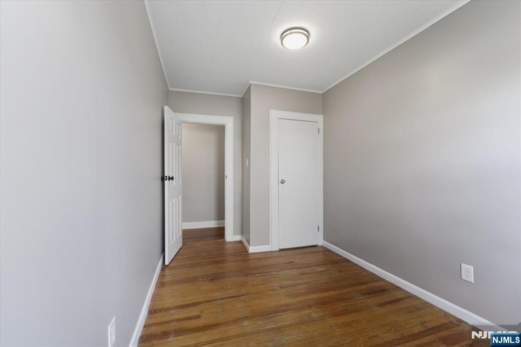 102 Exton Avenue North Arlington, NJ 07031 - Photo 10 of 18 a view of a room with wooden floor