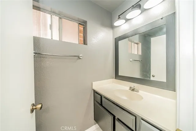 a bathroom with a sink and mirror