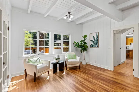 a kitchen with stainless steel appliances granite countertop a sink a stove and cabinets