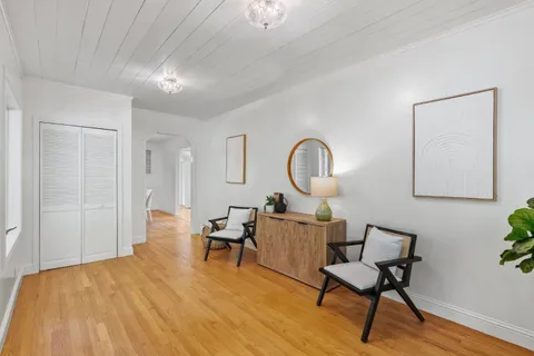 a bathroom with a sink and mirror with toilet